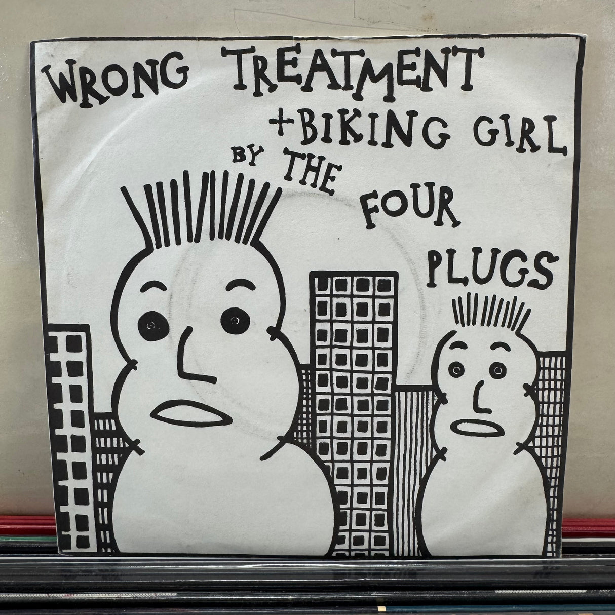 The Four Plugs - Wrong Treatment + Biking Girl - 7 inch Single - VINYL